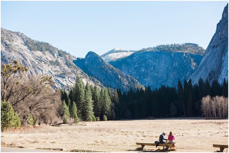 couple on a bench in yosemite meadow