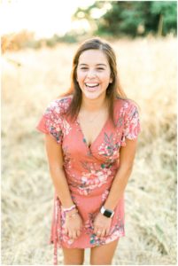 girl in a pink dress laughing