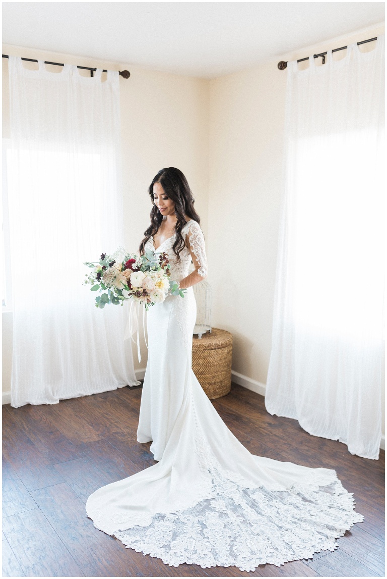 Portrait of a beautiful bride in a light filled room, photography by Jody Atkinson