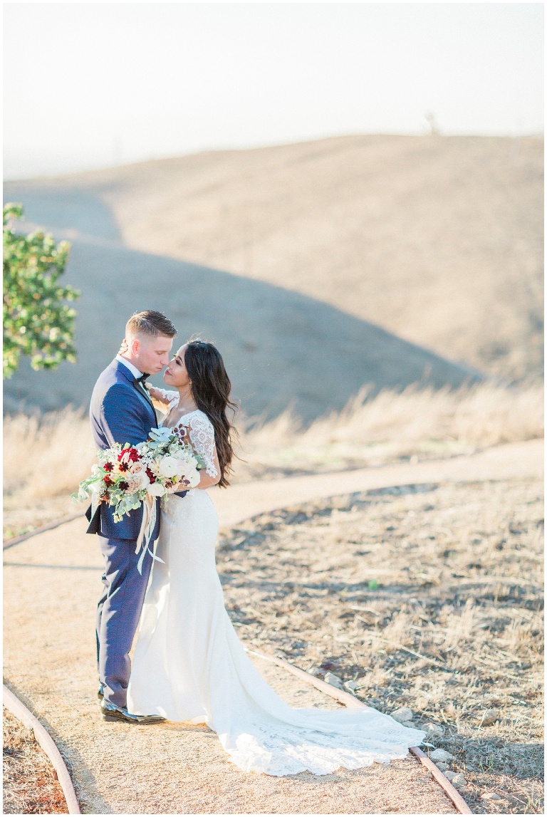 bride and groom portraits on a windy hilltop, jody Atkinson photography