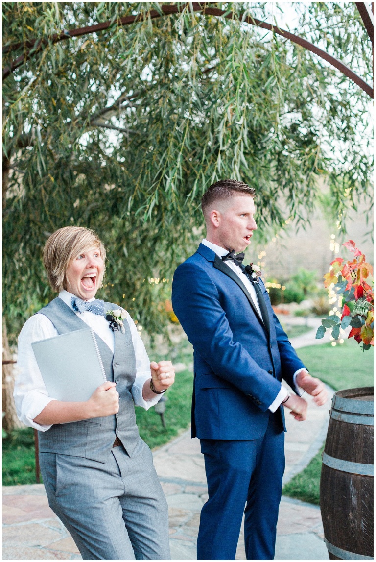 groom excited to see his bride walking down the isle, officiant excited too