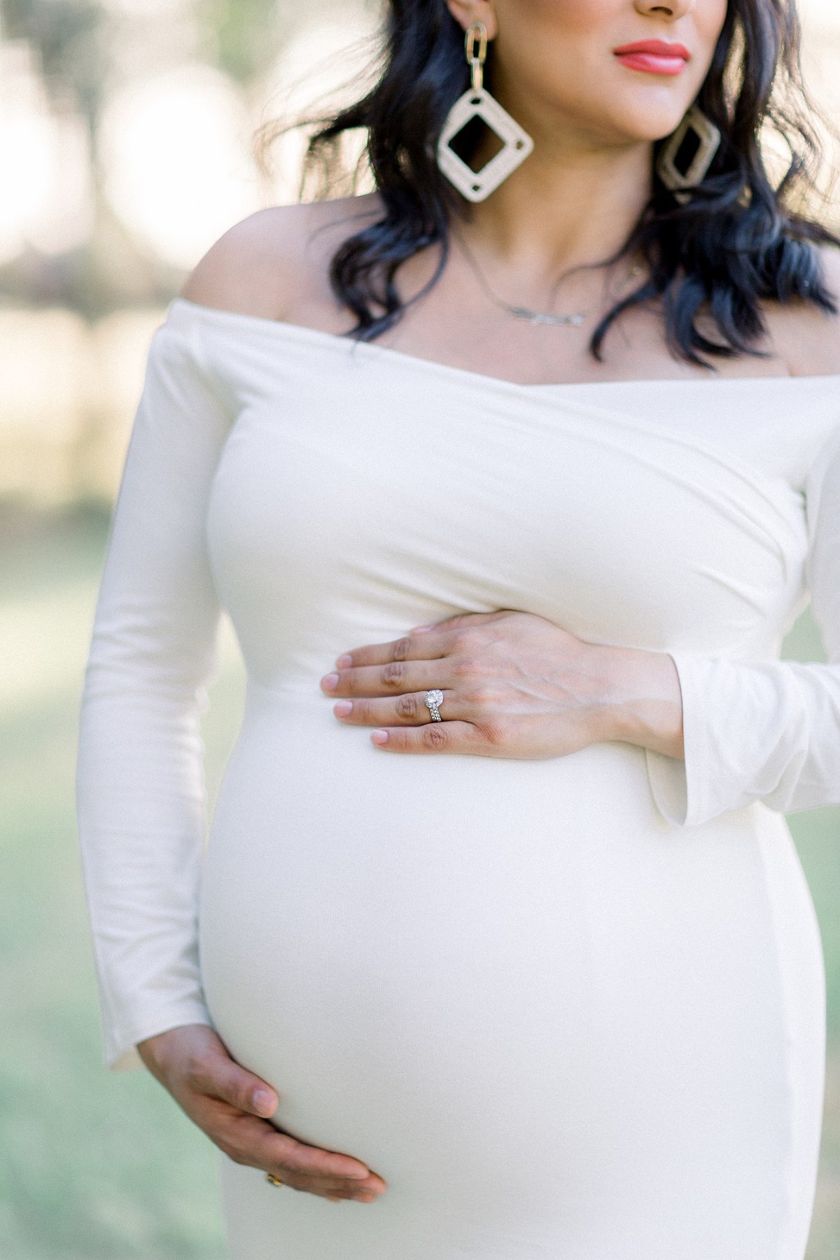 pregnant woman in a white dress