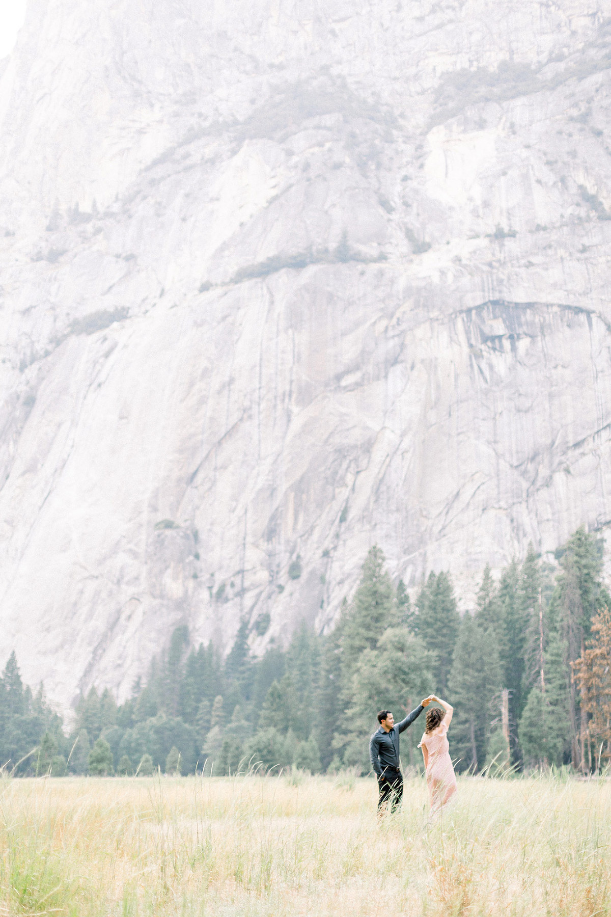 couple dancing in Yosemite national park in a meadow
